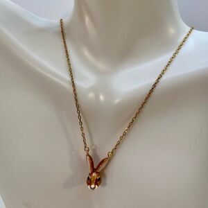 Kate Spade Desert Muse Pendant on delicate gold toned chain.